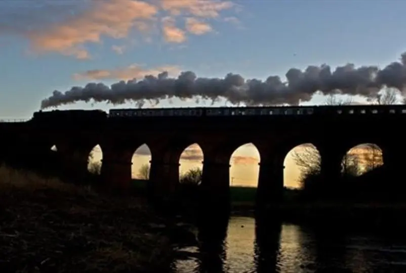The East Lancashire Railway travelling over the Summerseat Viaduct