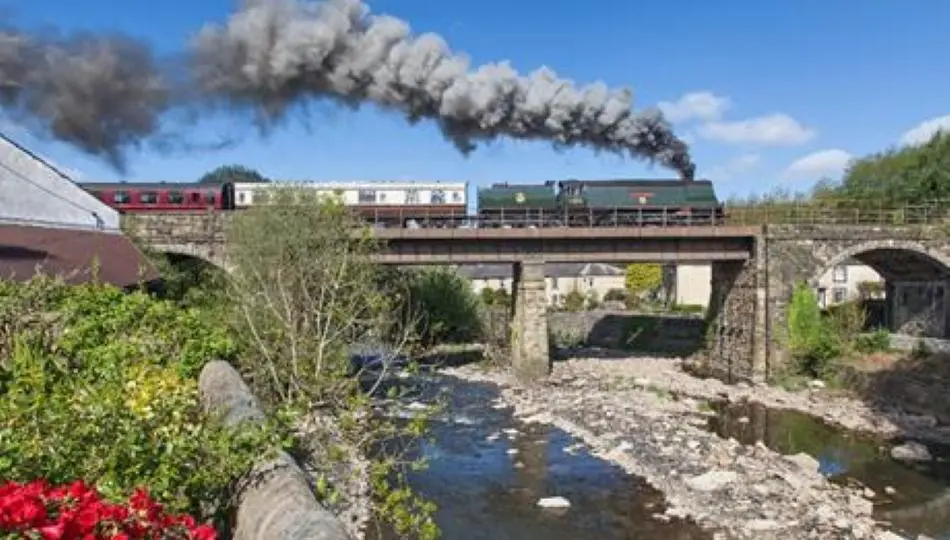 East Lancashire Railway train travelling over a bridge