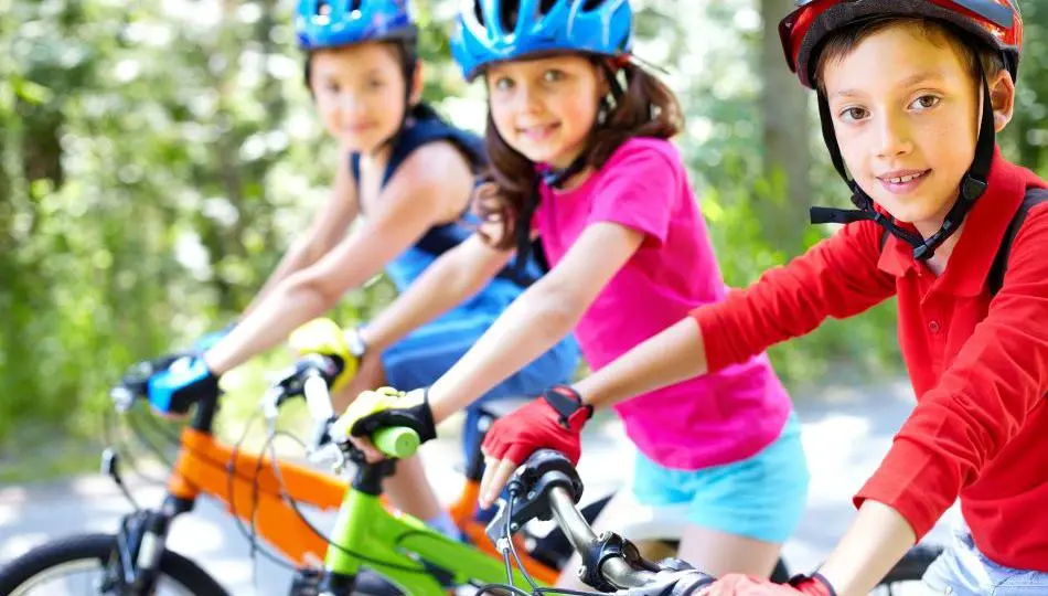 Three children cycling